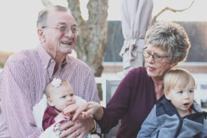 An old couple holding kids-Senior Planning Services in Bloomfield CT